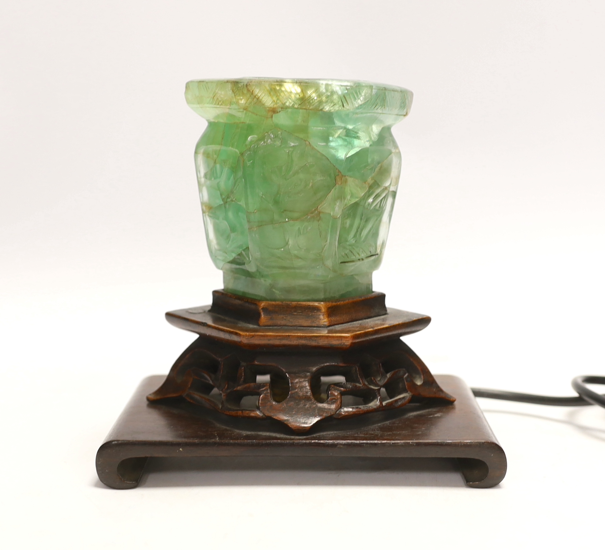 A Chinese green quartz and carved hardwood table lamp